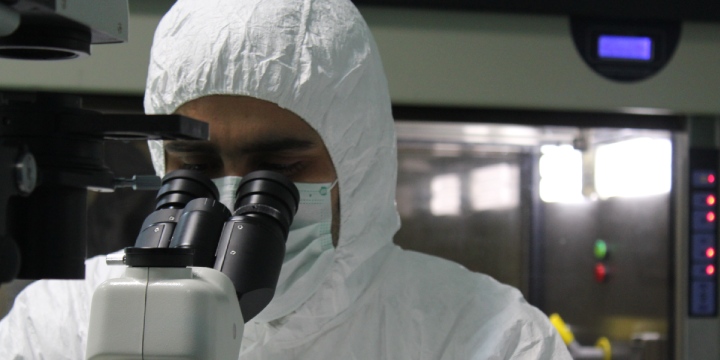 Young female pharmacist posing while working in a pharmacy